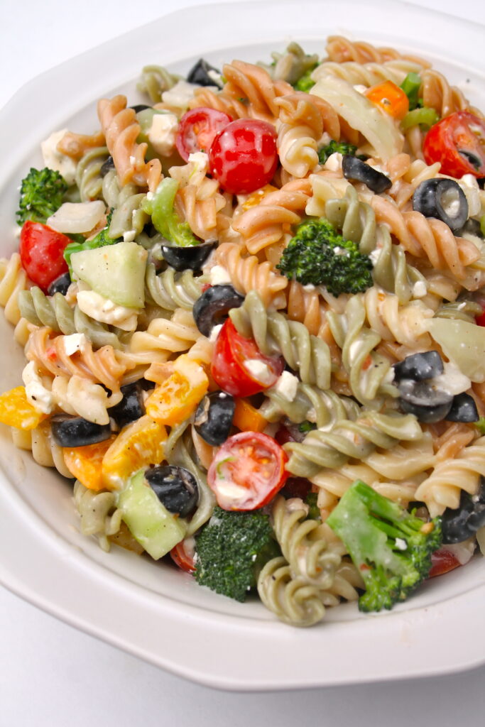 A bowlful of Creamy Italian Pasta Salad bursting with color and flavor!