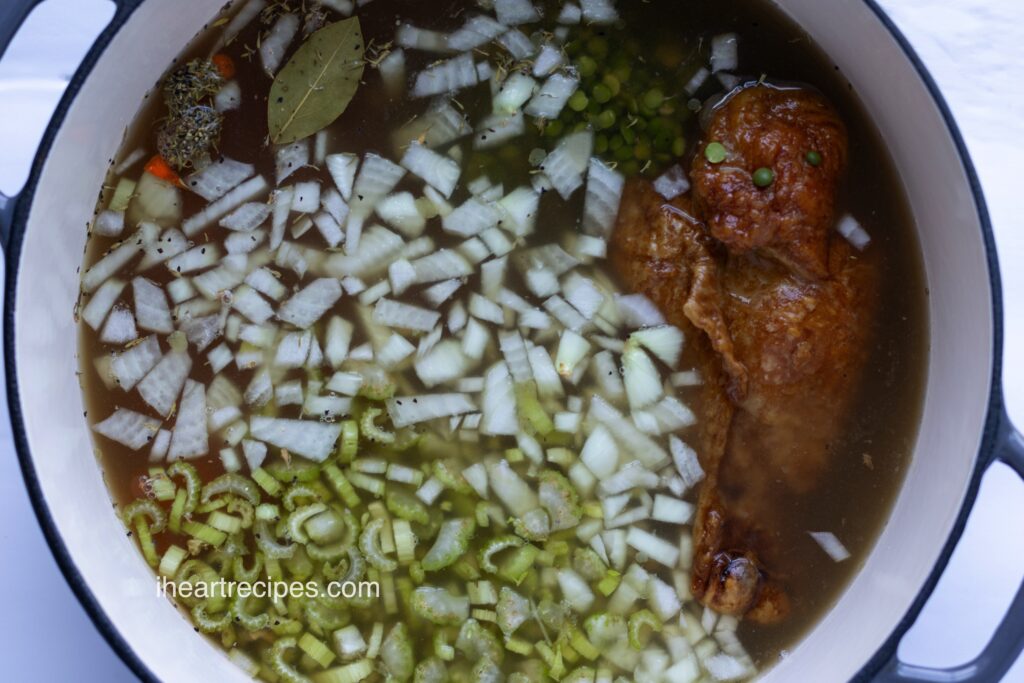 A large pot of simmering Smoked Turkey Split Pea Soup. 