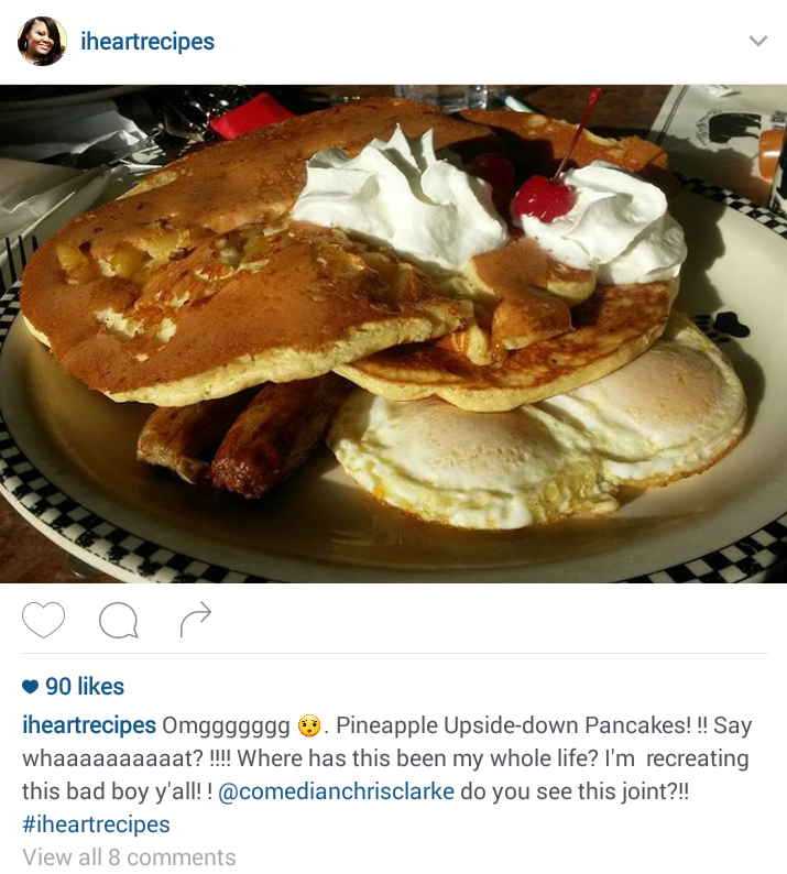 A screenshot of an I Heart Recipes Instagram post showing a picture of pineapple upside down pancakes on a plate with eggs and sausage.